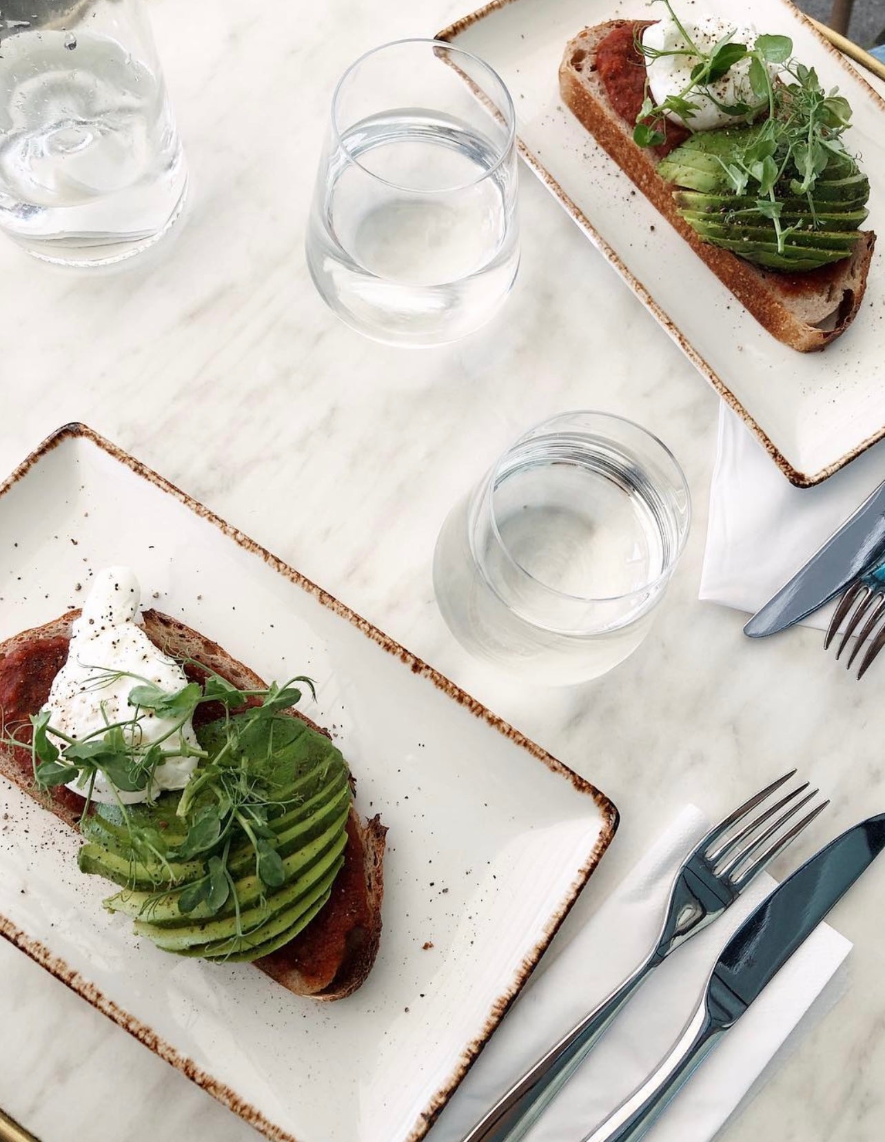 Avocado toast breakfast with a poached egg, styled for a morning routine