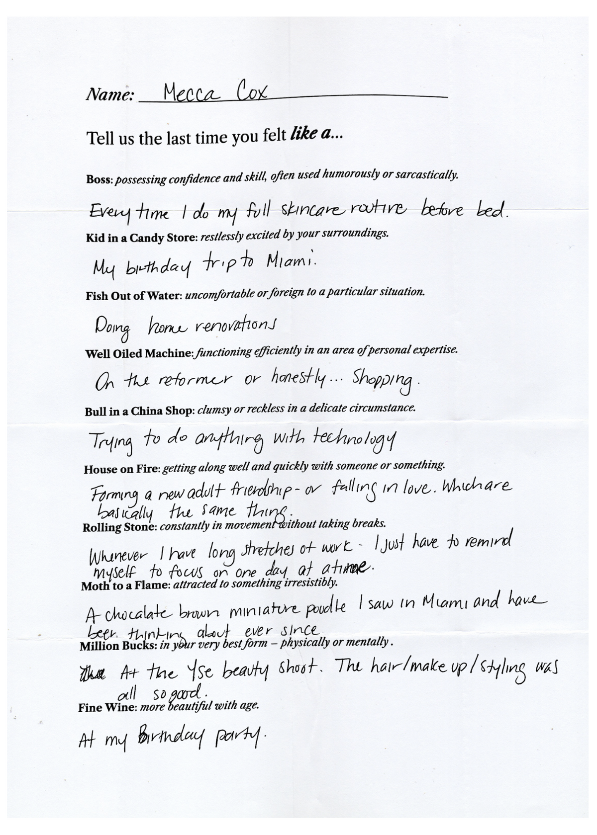 Handwritten questionnaire signed Mecca Cox, answering prompts like 'Tell us the last time you felt like a Boss, Kid in a Candy Store, Fish Out of Water' with her personal answers.