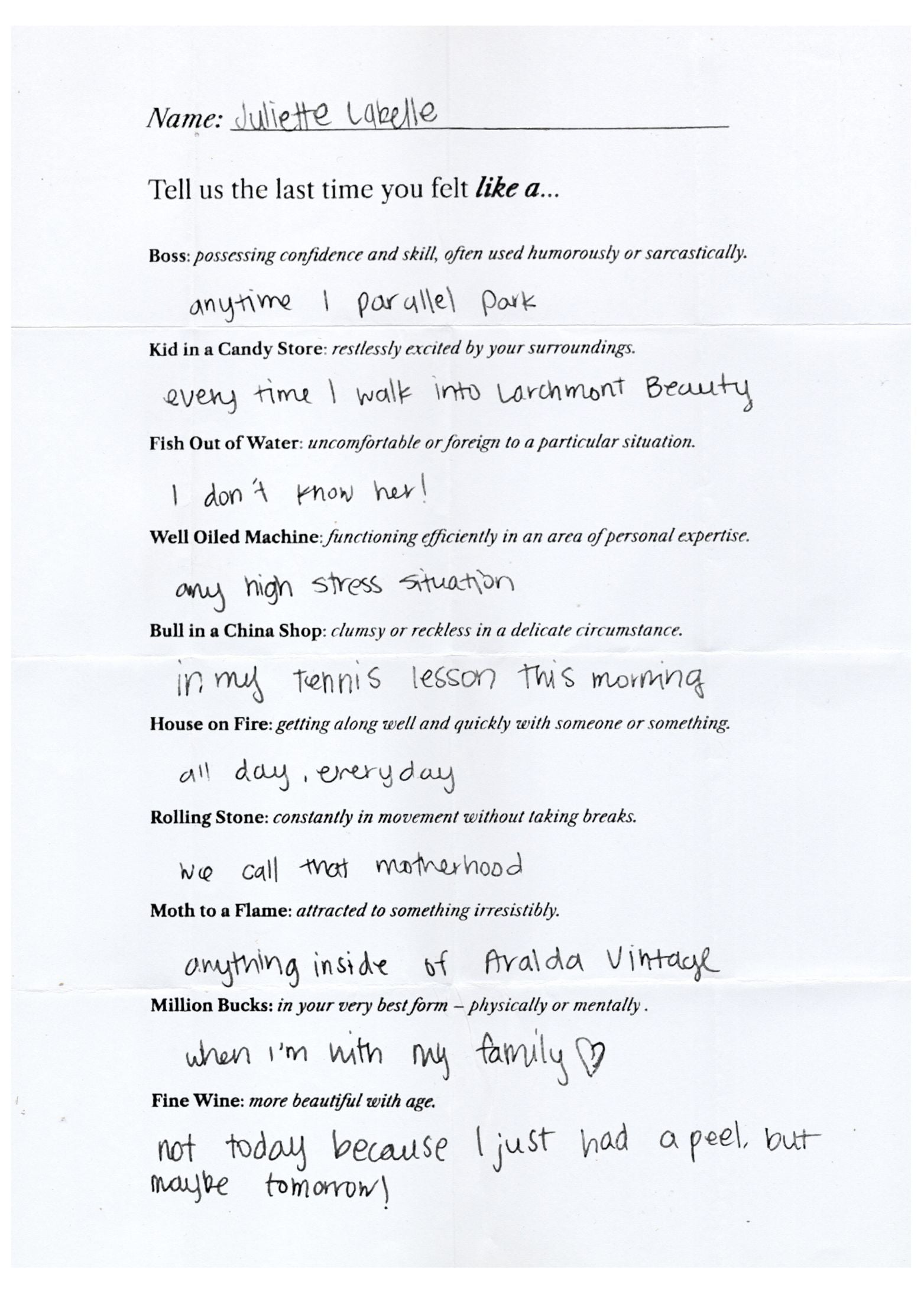 Handwritten questionnaire signed Juliette Labelle, answering prompts like 'Tell us the last time you felt like a Boss, Kid in a Candy Store, Fish Out of Water' with her personal answers.
