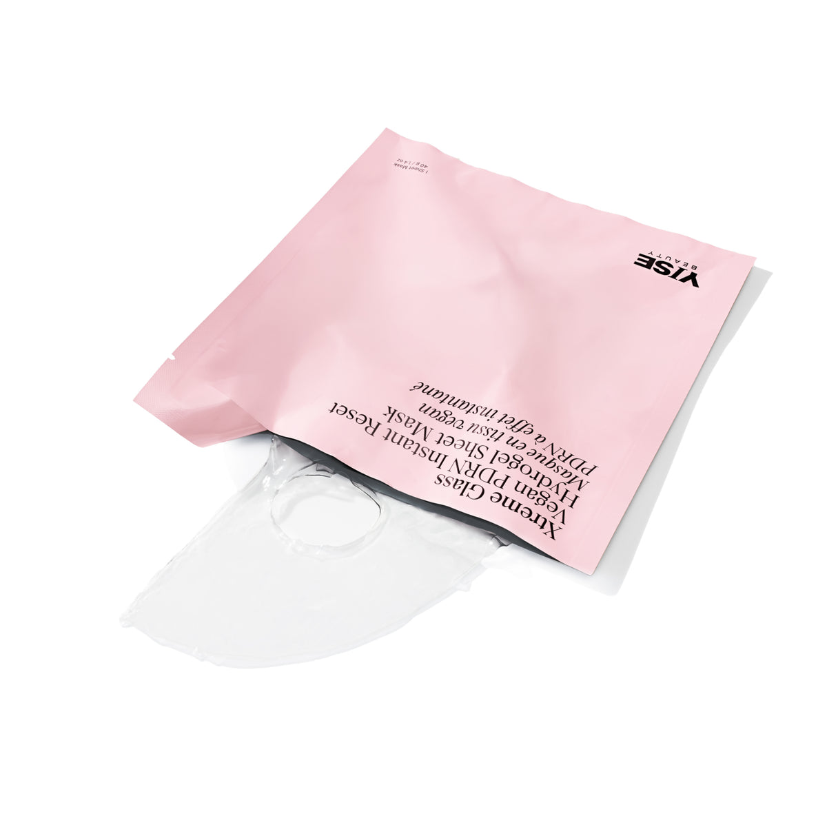 A translucent clear face mask partially pulled from a light pink resealable pouch with black printed text and the VISE logo, photographed on a clean white background.