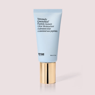 Xtremely Quenched Peptide Instant Glow Moisturizer in a light blue tube with a gold cap